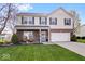 Charming two-story home featuring brick accents, manicured lawn, and attached two car garage at 19510 Pathway Point, Noblesville, IN 46062