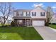 Charming two-story home featuring brick accents, manicured lawn, and attached two car garage at 19510 Pathway Point, Noblesville, IN 46062