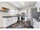 Well-lit kitchen features stainless steel appliances, sleek dark countertops, and white cabinetry at 19510 Pathway Point, Noblesville, IN 46062