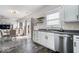 Bright kitchen features white cabinets, stainless steel appliances, and an open view to the living area at 19510 Pathway Point, Noblesville, IN 46062
