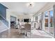 Open concept living and dining area with modern furnishings, wood floors, and sliding glass door at 19510 Pathway Point, Noblesville, IN 46062