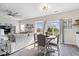 Open concept living and dining area with modern furnishings, wood floors, and sliding glass door at 19510 Pathway Point, Noblesville, IN 46062