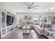 Cozy living room boasts a plush sectional, built-in shelving, and lots of natural light at 19510 Pathway Point, Noblesville, IN 46062
