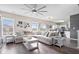 Bright living room showcasing a large sectional sofa and open layout to kitchen at 19510 Pathway Point, Noblesville, IN 46062