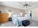 The bright main bedroom has a ceiling fan and neutral paint at 19510 Pathway Point, Noblesville, IN 46062