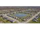 Serene aerial view showcases a suburban community with a central pond and fountain at 20515 Quicksilver Rd, Noblesville, IN 46062