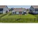 Spacious backyard with a lush green lawn and a black fence at 20515 Quicksilver Rd, Noblesville, IN 46062