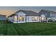 Well-maintained backyard featuring a patio area and lush green lawn at 20515 Quicksilver Rd, Noblesville, IN 46062