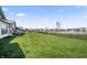 Expansive fenced backyard with a pond and water fountain feature at 20515 Quicksilver Rd, Noblesville, IN 46062