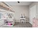 Comfortable bedroom featuring a loft bed, a vanity, and ample storage, creating a cozy and functional space for relaxation at 20515 Quicksilver Rd, Noblesville, IN 46062