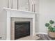 Elegant fireplace with a decorative mantel, offering a cozy focal point and warmth to the room at 20515 Quicksilver Rd, Noblesville, IN 46062