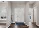 Bright foyer with hardwood floors, a stylish rug, and a view into other rooms at 20515 Quicksilver Rd, Noblesville, IN 46062