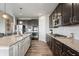 Well-equipped kitchen with stainless steel appliances, granite countertops, dark cabinetry, and ample counter space at 20515 Quicksilver Rd, Noblesville, IN 46062