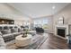 Spacious living room with an open layout, perfect for entertaining and relaxation, next to the kitchen at 20515 Quicksilver Rd, Noblesville, IN 46062