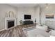 Comfortable living room with a fireplace, modern furniture, and open space for Gathering gatherings and relaxing at 20515 Quicksilver Rd, Noblesville, IN 46062