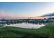Serene pond view surrounded by homes and grassy common areas at 20515 Quicksilver Rd, Noblesville, IN 46062