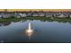 Scenic pond with a fountain feature, surrounded by well-maintained homes and lush landscaping at 20515 Quicksilver Rd, Noblesville, IN 46062