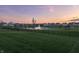 Scenic view of pond and landscaped community with a fountain feature at 20515 Quicksilver Rd, Noblesville, IN 46062