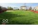 Beautiful lawn with trees and fence and basketball court in the backyard at 2093 Autumn Faith Way, Avon, IN 46123
