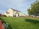 Beautiful backyard with lawn, mature tree, patio area and well-maintained fencing at 2093 Autumn Faith Way, Avon, IN 46123