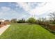 Expansive backyard featuring lush green grass and well-maintained fencing at 2093 Autumn Faith Way, Avon, IN 46123