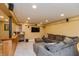 Finished basement features a wet bar, a large sectional sofa, and a flat-screen TV at 2093 Autumn Faith Way, Avon, IN 46123