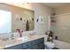 Charming bathroom featuring a double sink vanity, decorative accents, and a shower-tub combo at 2093 Autumn Faith Way, Avon, IN 46123