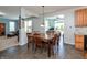 Dining area provides a seamless flow to kitchen, living, and outdoor areas with ample natural light at 2093 Autumn Faith Way, Avon, IN 46123