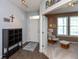 Welcoming entryway with decor and view into an adjacent sitting room filled with natural light at 2093 Autumn Faith Way, Avon, IN 46123