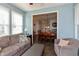 Comfortable living area featuring a sofa, armchair, and open view into the dining area at 2093 Autumn Faith Way, Avon, IN 46123