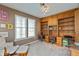 Functional home office with built-in shelving, dual workstations, and ample natural light, perfect for productivity at 2093 Autumn Faith Way, Avon, IN 46123