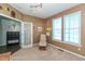 Cozy sitting room with two windows and comfortable rocking chair for relaxation and enjoying natural light at 2093 Autumn Faith Way, Avon, IN 46123