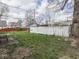 Spacious backyard with a weathered fence and mature tree providing shade at 213 N Walnut St, Edinburgh, IN 46124