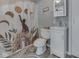 Charming bathroom featuring a toilet, sink with vanity, and a unique cat-themed shower curtain at 213 N Walnut St, Edinburgh, IN 46124
