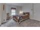 Cozy bedroom with neutral carpet, simple decor, and a comfortable bed setup at 213 N Walnut St, Edinburgh, IN 46124