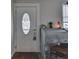 Inviting entryway with a charming vintage desk and decorative touches, adjacent to the front door at 213 N Walnut St, Edinburgh, IN 46124