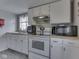 Well-equipped kitchen with white appliances and efficient layout for cooking and meal prep at 213 N Walnut St, Edinburgh, IN 46124