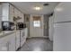 Practical kitchen featuring white appliances and cabinets, perfect for culinary adventures at 213 N Walnut St, Edinburgh, IN 46124
