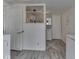 Laundry room featuring a washer, dryer, and doorway leading to a bathroom with a decorative shower curtain at 213 N Walnut St, Edinburgh, IN 46124