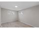 Neutral bedroom with modern flooring and natural light from two windows at 217 Eikenberry St, Greenfield, IN 46140