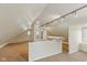 Large bonus room with track lighting and neutral carpet at 217 Eikenberry St, Greenfield, IN 46140