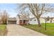 Charming single-Gathering home featuring a well-maintained lawn and a convenient carport at 217 Eikenberry St, Greenfield, IN 46140