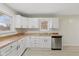 Bright kitchen featuring white cabinets, butcher block countertops, and stainless steel appliances at 217 Eikenberry St, Greenfield, IN 46140