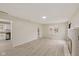 Open living room featuring modern flooring and a cozy fireplace at 217 Eikenberry St, Greenfield, IN 46140