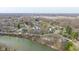 The aerial shows the property's serene riverside location, offering peaceful neighborhood charm at 218 Miami Dr, Noblesville, IN 46062