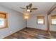 Neutral bedroom featuring wood-look floors, a ceiling fan, and natural wood trim at 218 Miami Dr, Noblesville, IN 46062