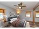 Comfortable bedroom with a ceiling fan, wood-trimmed windows, and ample natural light at 218 Miami Dr, Noblesville, IN 46062