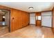 Bedroom with natural wood paneling complemented by hardwood floors, offering a blend of rustic charm and modern functionality at 218 Miami Dr, Noblesville, IN 46062