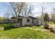 Charming home with a large yard, patio, and covered porch offers a perfect blend of indoor and outdoor living at 218 Miami Dr, Noblesville, IN 46062