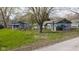 Charming home exterior with well-maintained lawn and mature trees at 218 Miami Dr, Noblesville, IN 46062